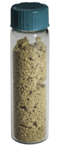A vial of O-Ring Bake-Out Residue